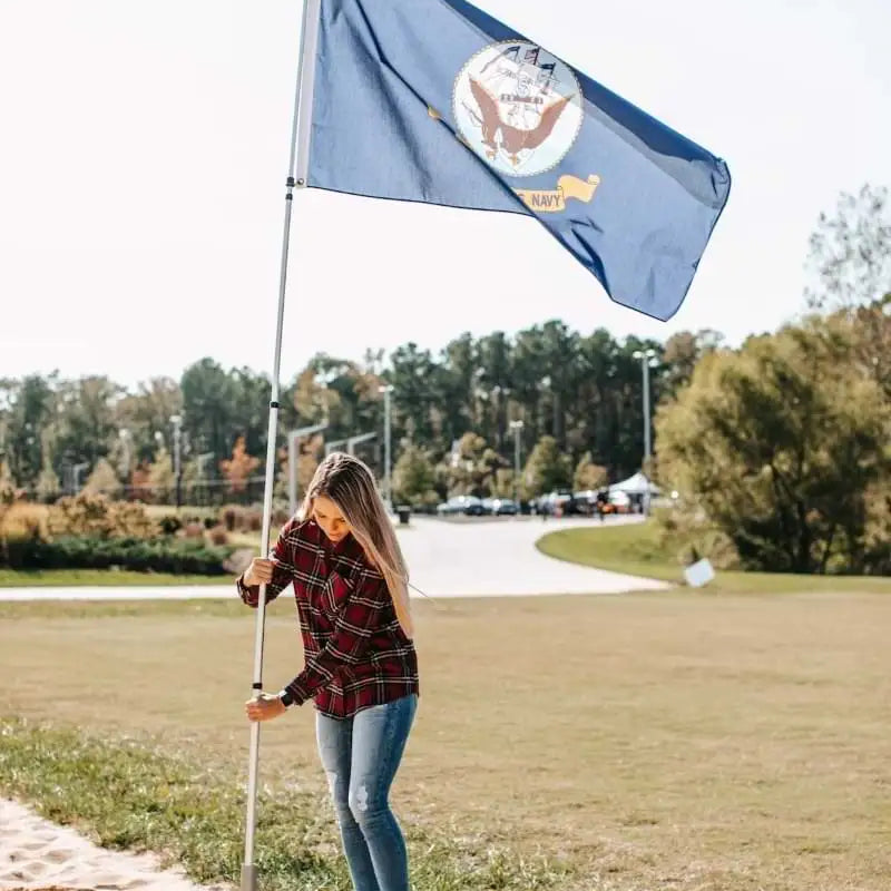 woman flying US Navy flag