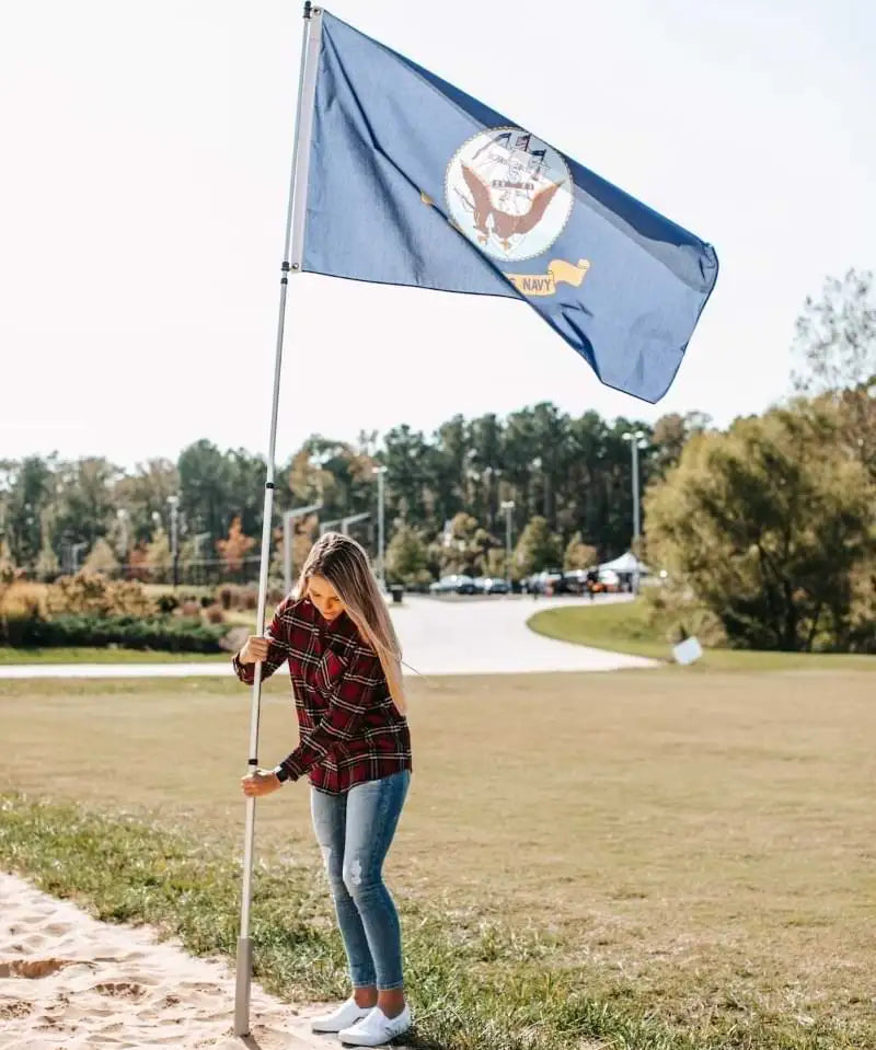 woman flying US Navy flag
