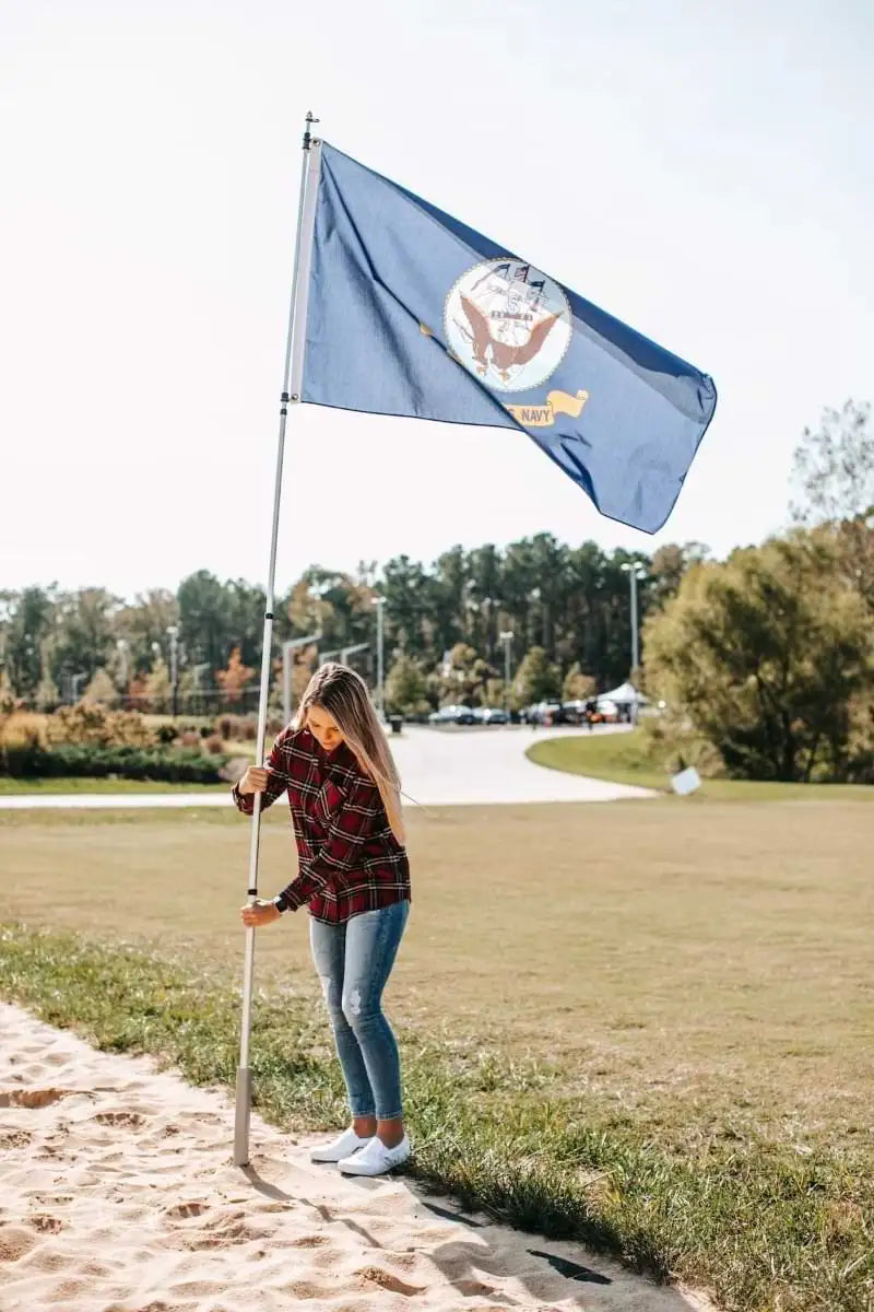 woman flying US Navy flag
